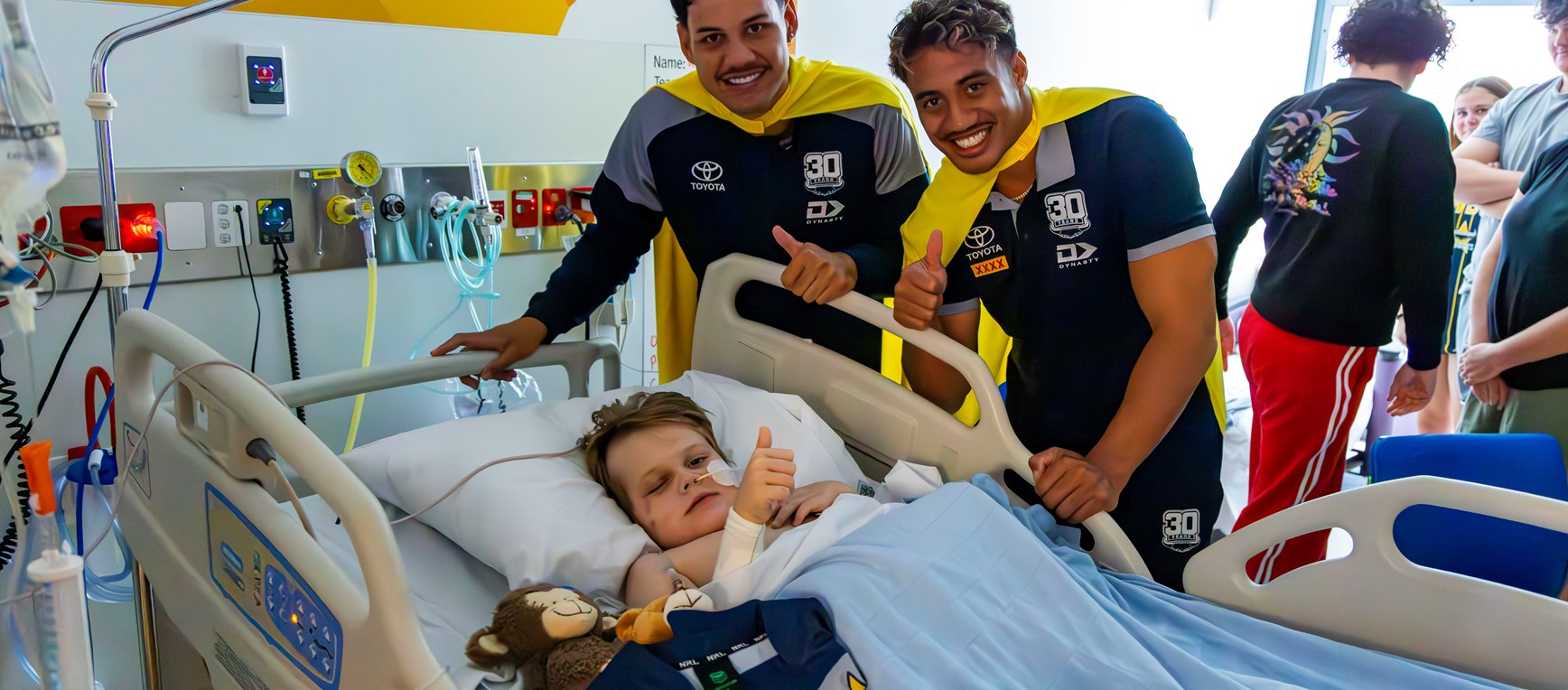 Cowboys in Capes visit Ronald McDonald House Family Room