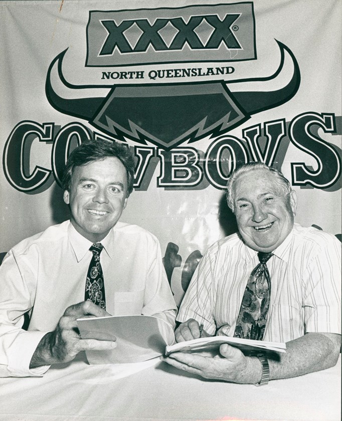Former Managing Director of Castlemaine Perkins Ray Weekes and Cowboys founding chairman Ron McLean sign the historic partnership